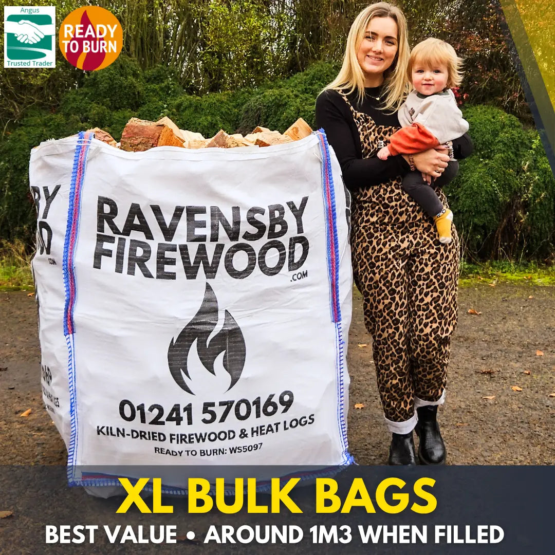 Woman holding a child next to an XL bulk bag of kiln-dried firewood logs with promotional text saying Ravensby Firewood.