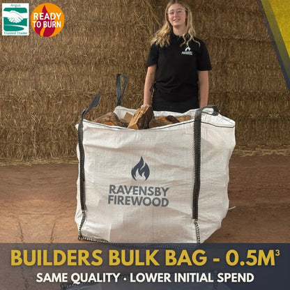 Person standing next to a builders, tonne  firewood bulk bag of Ravensby Firewood kiln-dried logs in Arbroath, Angus, with text about bulk bag size and use