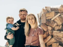 Ravensby Firewood family members standing next to a bulk load of kiln-dried logs in Carnoustie