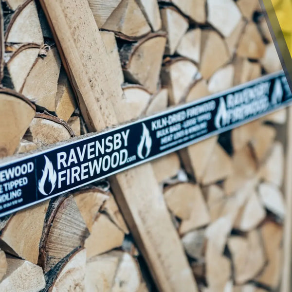 Crate of Hardwood Logs stacked in a yard in Carnoustie, Angus with Ravensby Firewood branding. 