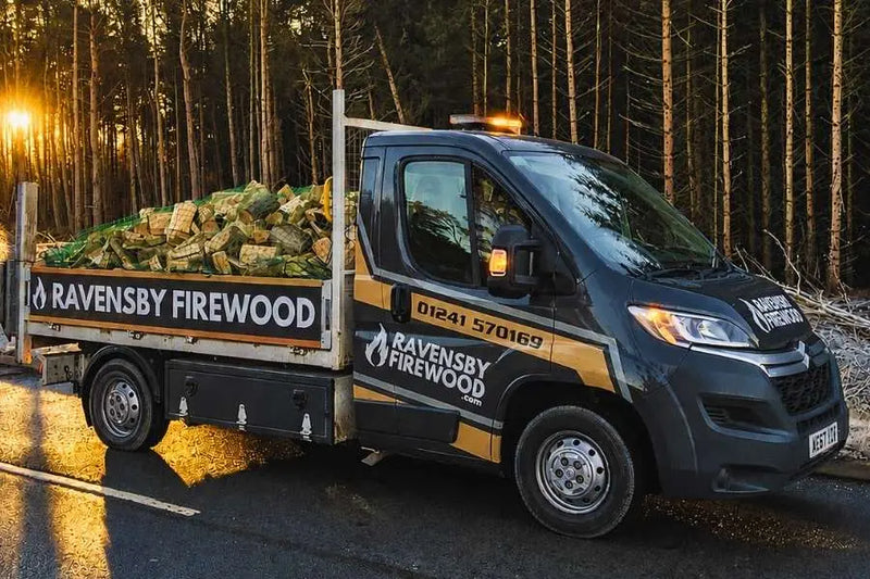 Ravensby Firewood delivery vehicle carrying loose tipped load of hardwood logs in Friockheim