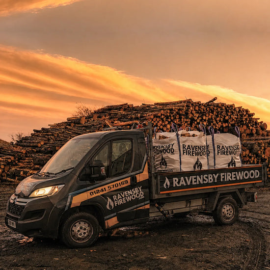 Ravensby Firewood delivery van loaded with kiln-dried bulk bags of hardwood logs in Fife against a sunset sky.