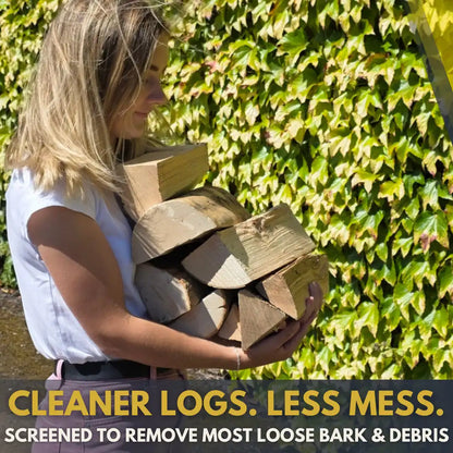 A woman outdoors holding a pile of cut kiln-dried firewood logs, with a background of green ivy. Text at the bottom reads 'CLEANER LOGS. LESS MESS'
