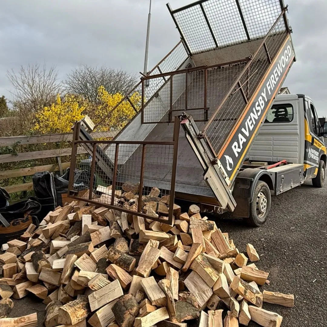 Truck loaded with kiln-dried firewood delivering angus logs to Arbroath with  'Ravensby Firewood' branding