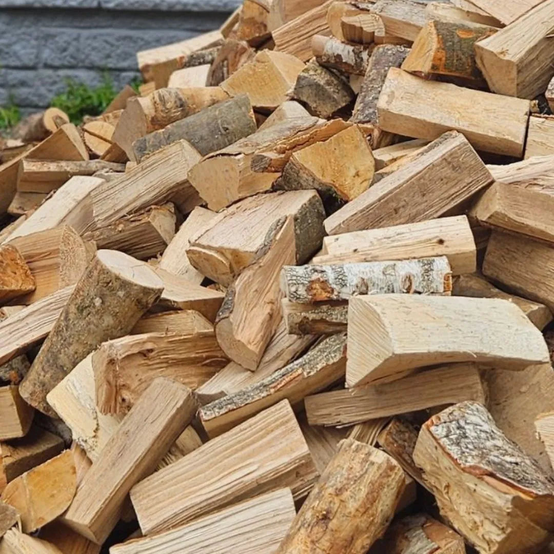 Stack of 10" kiln-dried firewood logs including Ash, Birch, Beech and Oak on a driveway in Dundee, Scotland