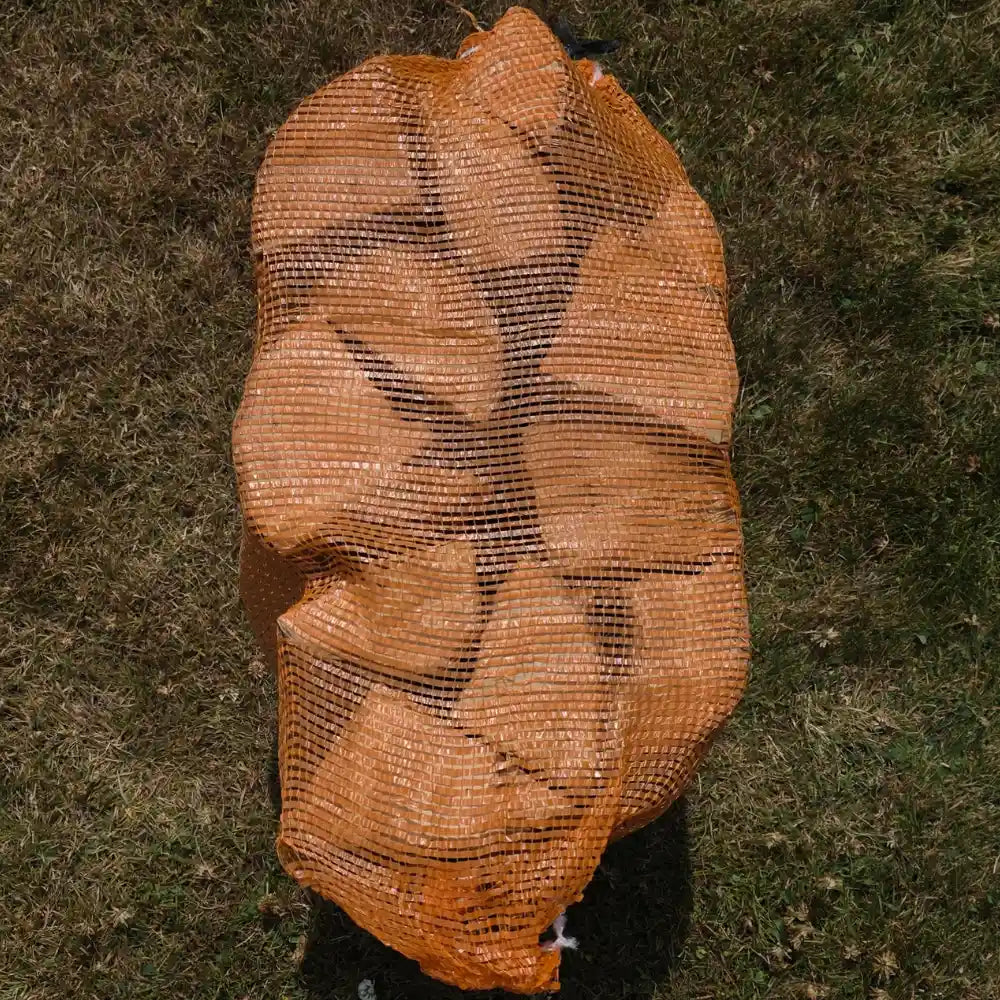 A bag of oak firewood taken outside the Ravensby Firewood log shop 