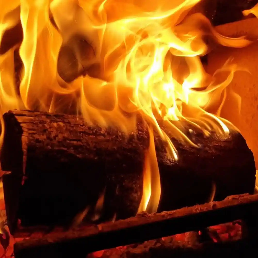 Close up of an Oak log on fire in a log burner